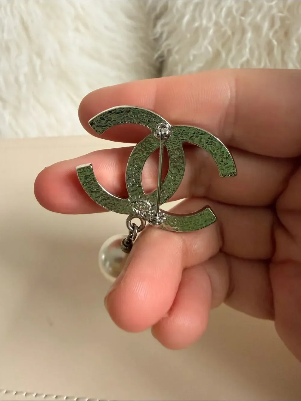CHANEL brooch showcasing